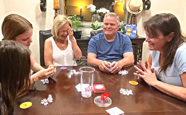 Family playing Really?! around table